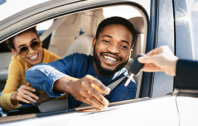 Man receiving keys for car